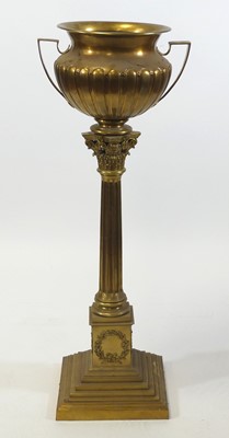 Lot 2564 - A late 19th century gilt brass twin handled...