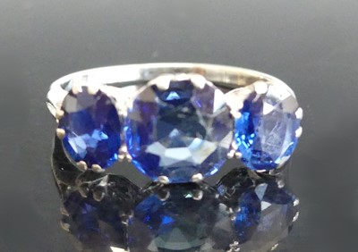 Lot 2517 - A white metal sapphire three stone ring...