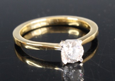 Lot 2320 - A contemporary 18ct gold diamond solitaire...