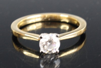 Lot 2320 - A contemporary 18ct gold diamond solitaire...