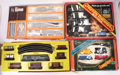 Lot 677 - Four 00 gauge train sets, to include: pick up...