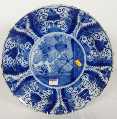 Lot 7 - An 18th century Dutch Delft charger, decorated...