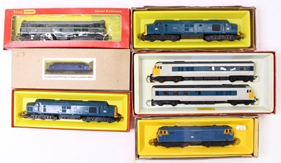 Lot 674 - A collection of five boxed Triang 00 gauge...