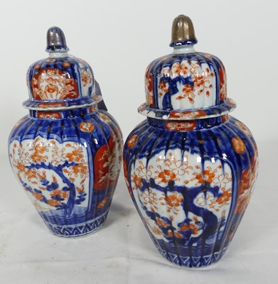 Lot 35 - A pair of Japanese Imari porcelain jars,...