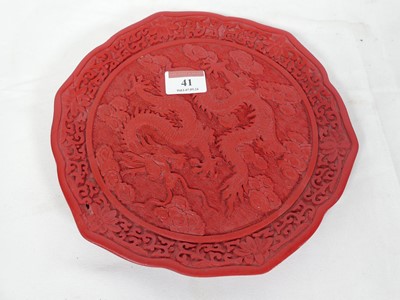 Lot 41 - A Chinese Cinnabar lacquer type plate, relief...