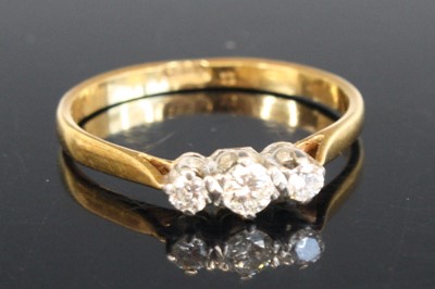 Lot 2549 - A yellow and white metal diamond three stone...