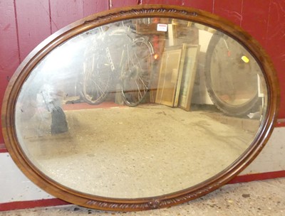 Lot 1156 - Two early 20th century oval bevelled wall mirrors