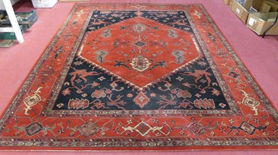 Lot 1162 - A contemporary machine woven red ground...