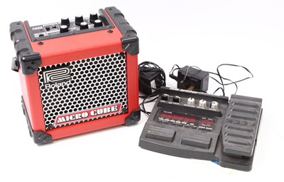 Lot 694 - A Roland Micro Cube guitar amplifier in red...