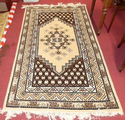 Lot 1166 - A Tunisian woollen cream ground Alloucha rug,...