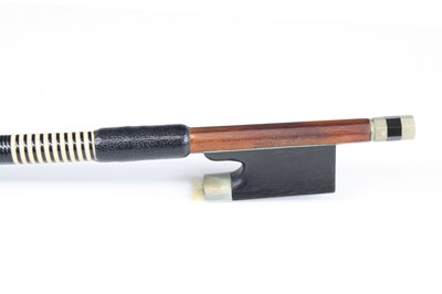 Lot 667 - A violin bow having a nickel adjustor with...