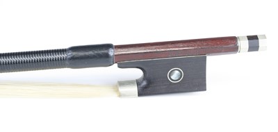 Lot 658 - A violin bow having a nickel adjuster with...