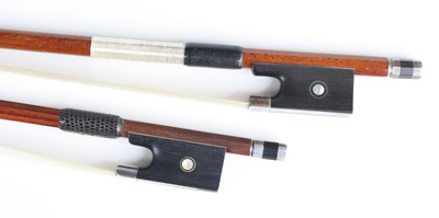 Lot 647 - An unmarked violin bow having white metal and...