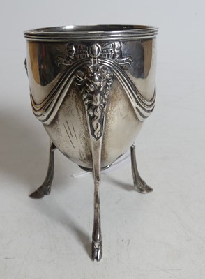 Lot 312 - A Victorian silver tripod cup, standing upon...