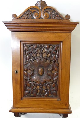 Lot 1193 - A late Victorian floral relief carved walnut...