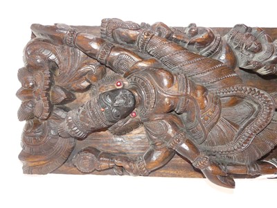 Lot 122 - An Indian carved wood panel, relief decorated...