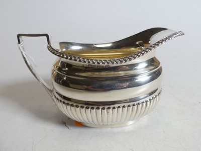 Lot 328 - A Victorian silver milk jug, of half-reeded...