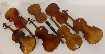 Lot 99 - A collection of seven student's violins, each...