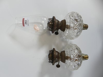 Lot 202 - A pair of Victorian cut glass oil lamp fonts,...