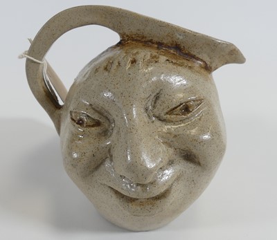 Lot 188 - In the style of Martin Brothers, a stoneware...