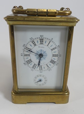 Lot 209 - A lacquered brass carriage clock having a...