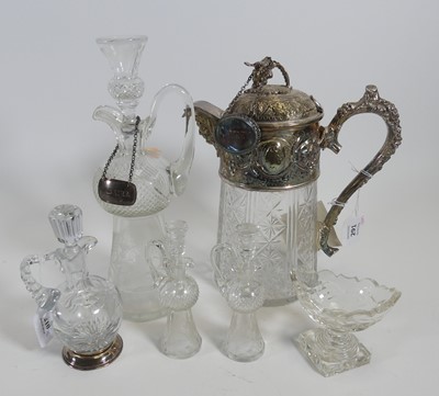 Lot 210 - A cut glass claret jug having silver plated...