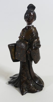 Lot 212 - A Japanese bronze figure of a geisha modelled...