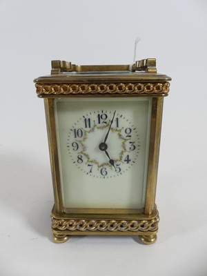 Lot 213 - A lacquered brass carriage clock, having a...