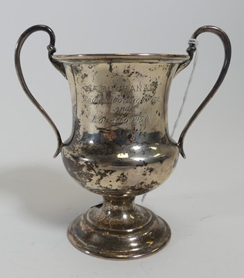 Lot 230 - A George V silver twin handled trophy,...