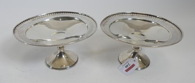 Lot 240 - A pair of George V silver comports, each...