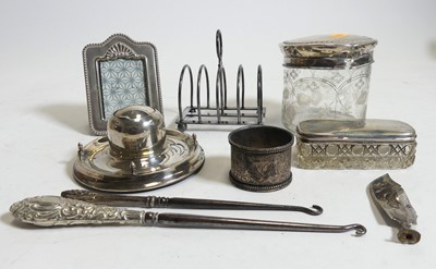 Lot 279 - A collection of silver, to include capstan...