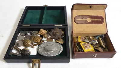 Lot 486 - A collection of military cap badges, to...