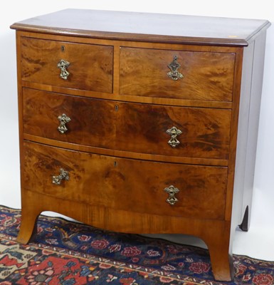 Lot 1209 - An early 20th century walnut and figured...