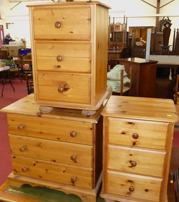 Lot 1217 - A pair of modern pine three-drawer bedside...