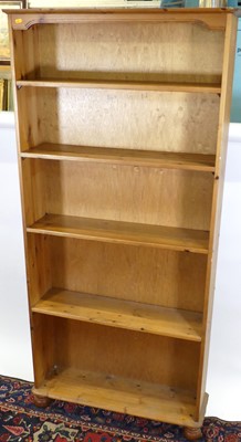 Lot 1218 - A modern pine freestanding open bookshelf,...