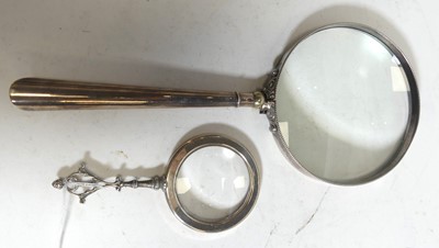 Lot 489 - A white metal clad hand-held magnifying glass,...