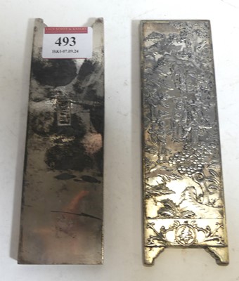 Lot 493 - A pair of Chinese white metal ingots, each...