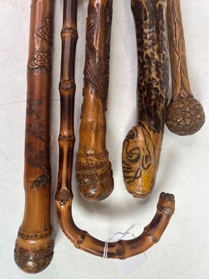 Lot 542 - A Chinese carved bamboo walking stick, length...