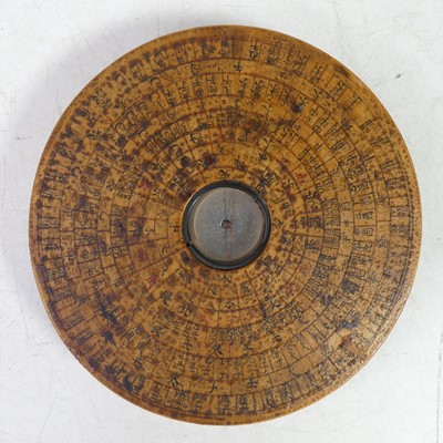 Lot 546 - A Chinese wooden cased compass, showing radial...