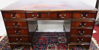 Lot 1246 - A reproduction mahogany and gilt tooled...