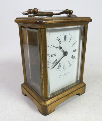 Lot 555 - A lacquered brass cased carriage clock, having...