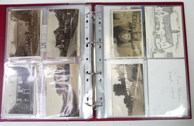 Lot 574 - A collection of postcards and photographs,...