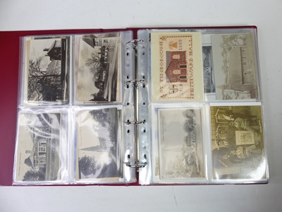 Lot 679 - An album of postcards and photographs, views...