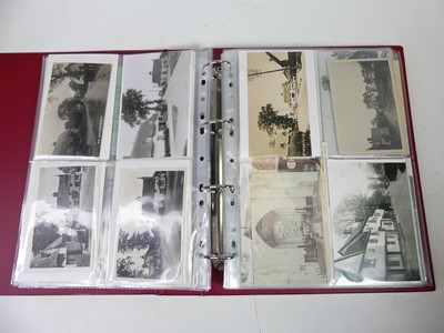 Lot 680 - A collection of postcards and photographs,...