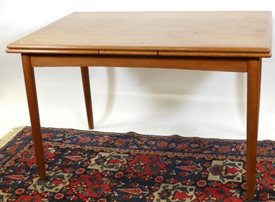 Lot 1429 - A 1960s teak draw-leaf dining table, raised on...