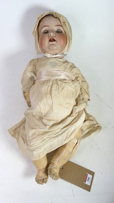 Lot 586 - A vintage bisque headed doll, having rolling...