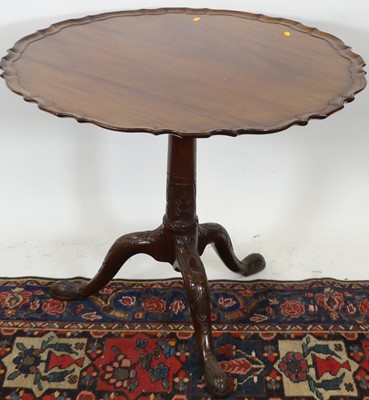 Lot 1287 - A mahogany circular piecrust tilt-top pedestal...