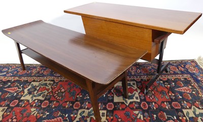 Lot 1298 - A 1970s plywood and stained beech two-tier low...