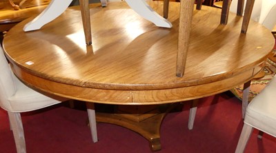 Lot 1322 - A hardwood circular pedestal breakfast table,...