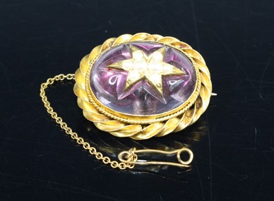 Lot 389 - A late Victorian yellow metal and amethyst set...